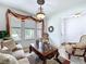 Elegant living room with neutral tones, large windows, and decorative furniture at 2939 Sera Bella Way, Kissimmee, FL 34744