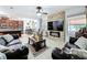 This spacious living room features an adjacent kitchen and comfortable seating at 2939 Sera Bella Way, Kissimmee, FL 34744