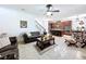 This spacious living room has an adjacent kitchen and a staircase at 2939 Sera Bella Way, Kissimmee, FL 34744