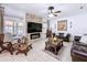 Relax in this cozy living room with a fireplace and comfortable seating at 2939 Sera Bella Way, Kissimmee, FL 34744