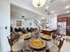 Open concept kitchen and living space with hardwood floors and dining area at 2939 Sera Bella Way, Kissimmee, FL 34744