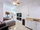 Bright living space with a kitchenette, television, and comfortable seating at 2939 Sera Bella Way, Kissimmee, FL 34744