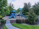 A colorful community playground featuring slides, climbing structures, and a safe, mulched ground at 2939 Sera Bella Way, Kissimmee, FL 34744