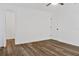 Bright bedroom with wood-look floors, and closet or bathroom entrance at 3 Rosewood Dr, Davenport, FL 33837