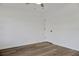 Bedroom showcasing wood-look floors, ceiling fan, and closet door at 3 Rosewood Dr, Davenport, FL 33837
