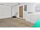 Garage featuring a garage door, door to the house, and washer and dryer at 3 Rosewood Dr, Davenport, FL 33837