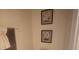Bathroom wall featuring framed artwork above a towel rack at 3162 Rodrick Cir, Orlando, FL 32824