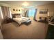 Cozy bedroom featuring a plush bed, ample natural light, and comfortable seating at 3162 Rodrick Cir, Orlando, FL 32824
