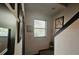 Hallway featuring natural light from window and staircase at 3162 Rodrick Cir, Orlando, FL 32824