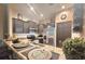 Cozy kitchen with granite countertops, stainless steel appliances, and dark cabinets at 3162 Rodrick Cir, Orlando, FL 32824