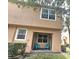Quaint outdoor patio area with cheerful blue chairs, perfect for relaxing and enjoying the community at 3162 Rodrick Cir, Orlando, FL 32824