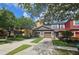 Attractive townhomes featuring attached garages and well-manicured lawns in a vibrant community setting at 3162 Rodrick Cir, Orlando, FL 32824