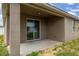 Covered porch area with a sliding glass door entrance to the home at 326 Highland Meadows Ave, Davenport, FL 33837