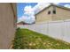 Fenced backyard with limited green space and proximity to neighboring houses, providing privacy at 326 Highland Meadows Ave, Davenport, FL 33837
