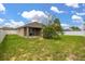 Backyard featuring grass, fencing, trees and the back of the home at 326 Highland Meadows Ave, Davenport, FL 33837