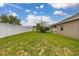 Backyard featuring grass, trees, and fencing at 326 Highland Meadows Ave, Davenport, FL 33837