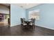Classic dining space with hardwood floors, a cozy ambiance, and views of the surrounding rooms at 326 Highland Meadows Ave, Davenport, FL 33837