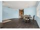 Dining space with stylish flooring and views of an open archway to other rooms at 326 Highland Meadows Ave, Davenport, FL 33837
