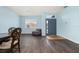 Cozy dining space with wood floors and comfortable seating near the entryway at 326 Highland Meadows Ave, Davenport, FL 33837