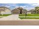 Inviting single-Gathering home with a 2-car garage, and tidy landscaping at 326 Highland Meadows Ave, Davenport, FL 33837