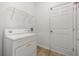 Laundry room featuring a washing machine and a wire shelf at 326 Highland Meadows Ave, Davenport, FL 33837
