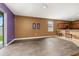 Spacious living room with wood-look floors adjacent to the kitchen at 326 Highland Meadows Ave, Davenport, FL 33837