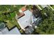 An aerial view showcases a gray roof, surrounding landscaping, and a glimpse of the neighborhood at 3621 Devonswood Dr, Orlando, FL 32806