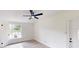 Cozy bedroom with ample natural light, neutral paint, and updated wood-look flooring at 3621 Devonswood Dr, Orlando, FL 32806