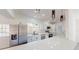 Well-equipped kitchen featuring stainless steel appliances, white cabinets, and a sunny window above the sink at 3621 Devonswood Dr, Orlando, FL 32806