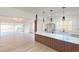 Open-concept living area leads to the gourmet kitchen with an island and stainless steel appliances at 3621 Devonswood Dr, Orlando, FL 32806