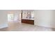 Bright, open-concept living area flows into the kitchen with wood-look flooring throughout at 3621 Devonswood Dr, Orlando, FL 32806