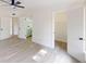 Bright main bedroom with ceiling fan and convenient access to the en-suite bathroom and walk-in closet at 3621 Devonswood Dr, Orlando, FL 32806