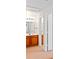 Bathroom features wood vanity, carpet and access to another bathroom at 4014 Santa Maria Dr # 101, Kissimmee, FL 34741