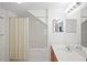 Bright white bathroom features a shower and tub combination with a large vanity area at 4014 Santa Maria Dr # 101, Kissimmee, FL 34741