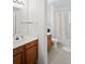 A bathroom featuring a light wood vanity and shower with tub at 4014 Santa Maria Dr # 101, Kissimmee, FL 34741