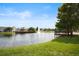Scenic view of a pond featuring a fountain and lakeside recreational area at 4014 Santa Maria Dr # 101, Kissimmee, FL 34741