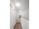 Stairway features neutral carpet, a light gray stairway banister and white walls at 4014 Santa Maria Dr # 101, Kissimmee, FL 34741