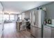 Open-concept living area flowing into the kitchen, featuring hardwood floors and modern finishes at 405 Eron Way # 39, Winter Garden, FL 34787