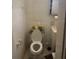 Modest bathroom with a toilet, sink, and cabinet, presenting basic amenities at 4339 Solomon Dr, Orlando, FL 32811