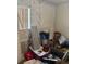 A bedroom filled with belongings, showing potential for comfortable living space at 4339 Solomon Dr, Orlando, FL 32811