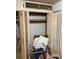 An open closet with personal items at 4339 Solomon Dr, Orlando, FL 32811