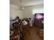 Dining room with a chandelier and TV at 4339 Solomon Dr, Orlando, FL 32811