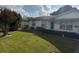 A well-maintained front yard with lush green grass and mature landscaping frames the home's facade at 4339 Solomon Dr, Orlando, FL 32811