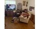 Cozy living room features a comfortable couch, TV, and a quaint decor at 4339 Solomon Dr, Orlando, FL 32811