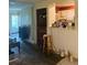 An open-concept living room with a view to the kitchen at 4339 Solomon Dr, Orlando, FL 32811
