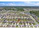 Community aerial view highlighting houses with green lawns and a red marker indicating location at 4492 Bluff Oak Loop, Kissimmee, FL 34746