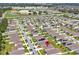 Aerial view of a quiet suburban community with a school nearby, providing a convenient Gathering-friendly location at 4492 Bluff Oak Loop, Kissimmee, FL 34746