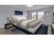 This bedroom features a comfortable bed, stylish decor, and plenty of natural light at 4492 Bluff Oak Loop, Kissimmee, FL 34746