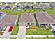 Charming single-story home with well-manicured lawn, neutral color palette, and convenient two-car garage at 4492 Bluff Oak Loop, Kissimmee, FL 34746