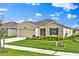 Attractive single-story house with a lovely landscaped front yard and a convenient two-car garage at 4492 Bluff Oak Loop, Kissimmee, FL 34746